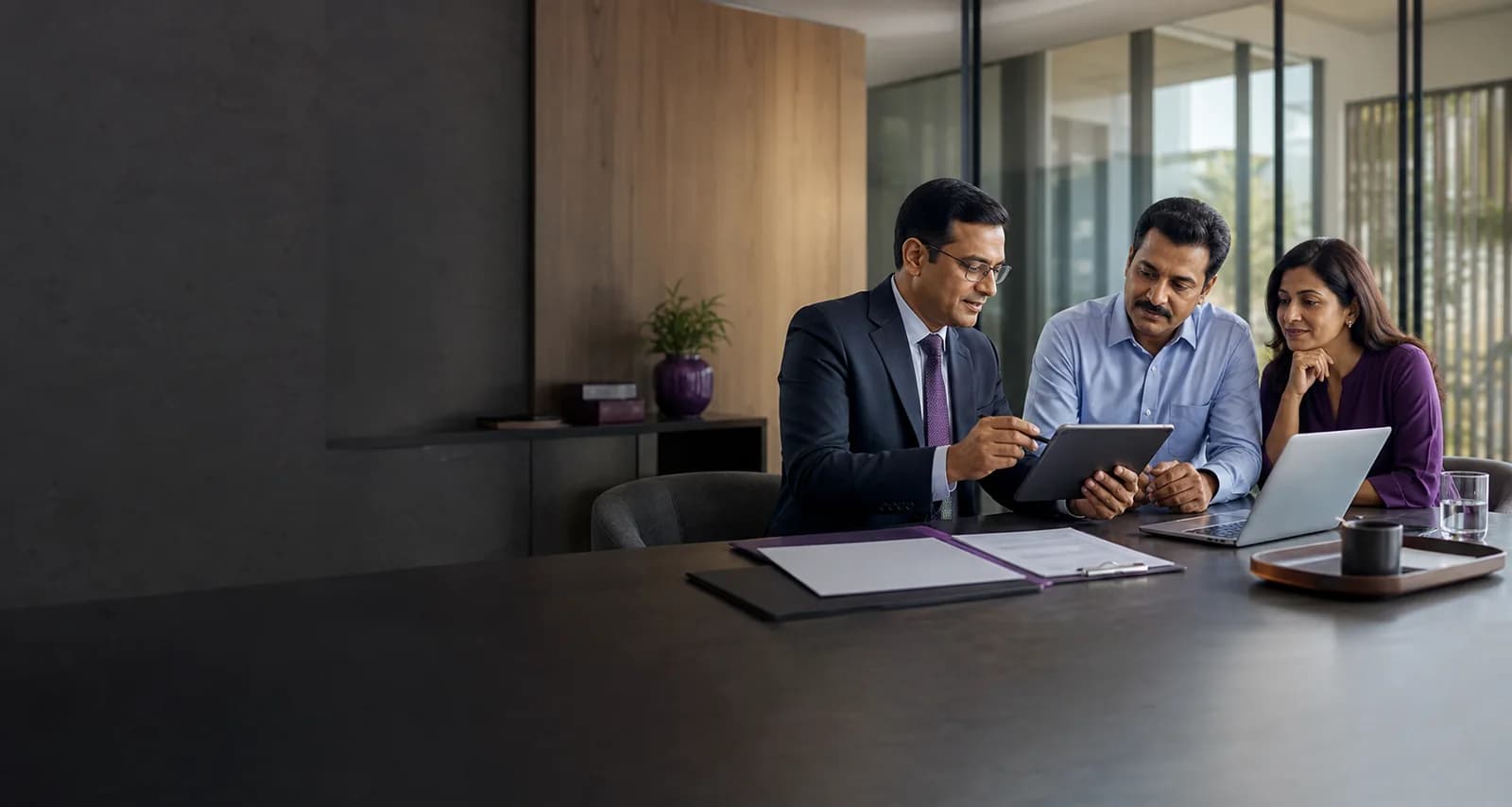 A financial advisor reviewing follow-up actions with clients